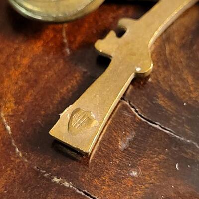 Lot 43: (4) U.S. Military Infantry Service Crossed Rifles Pins