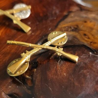 Lot 43: (4) U.S. Military Infantry Service Crossed Rifles Pins
