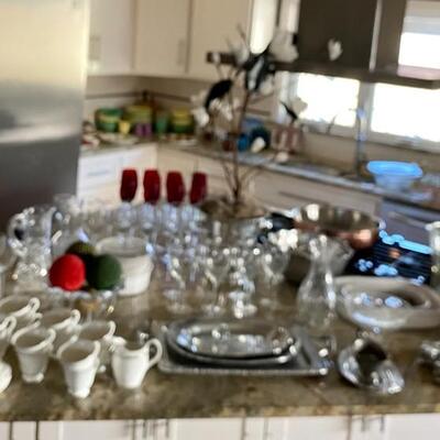 Tons of kitchen and serving ware! Crystal, china, silver serving pieces, pewter, seasonal, and so on and so on...Must see