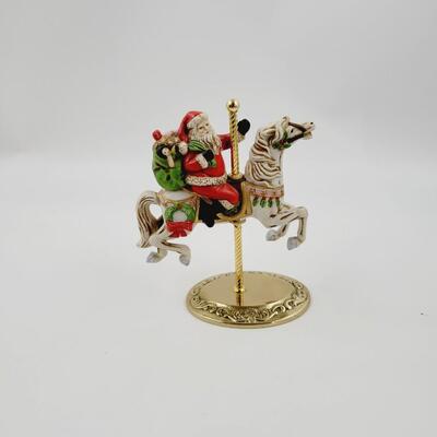 HOMCO SANTA ON A CAROUSEL HORSE DECOR