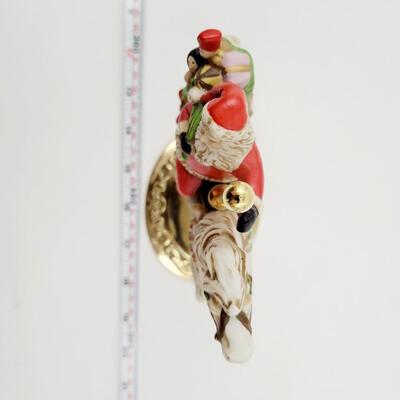 HOMCO SANTA ON A CAROUSEL HORSE DECOR