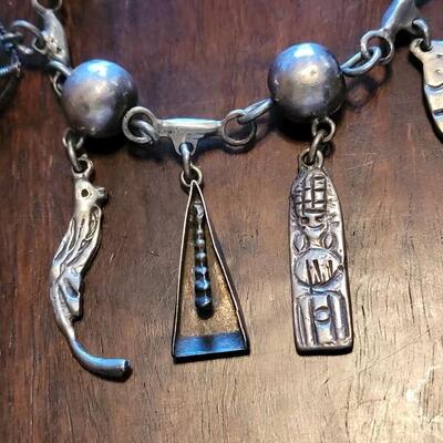 Lot 91: Vintage Mexican Mid Century Sterling Charm Bracelet