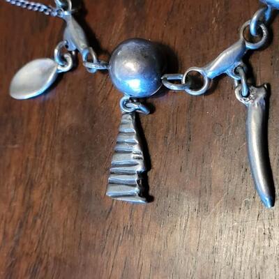 Lot 91: Vintage Mexican Mid Century Sterling Charm Bracelet