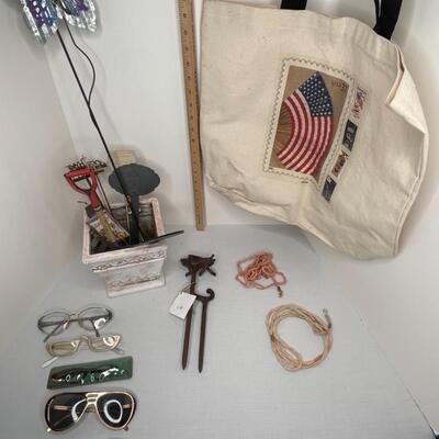 Misc glasses, tote, eyeglass holders, misc lawn spikes and plant type stakes, pot