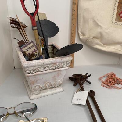 Misc glasses, tote, eyeglass holders, misc lawn spikes and plant type stakes, pot