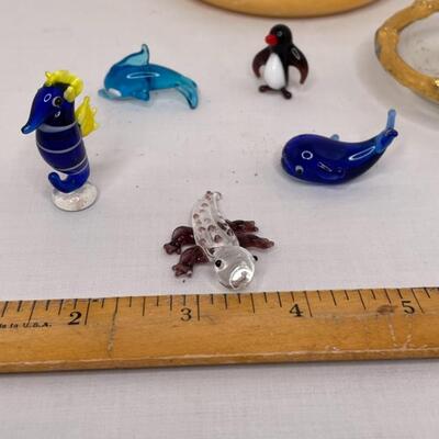 Metalware, napkin rungs, saucers, miniature animals, glass dish with lid