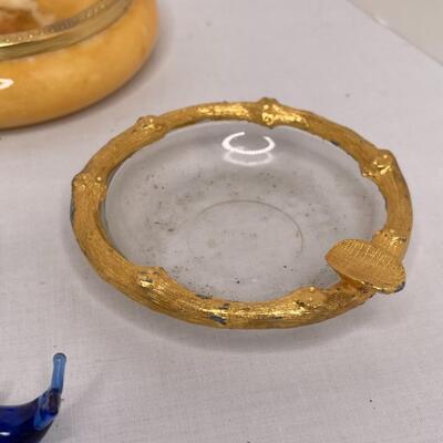Metalware, napkin rungs, saucers, miniature animals, glass dish with lid