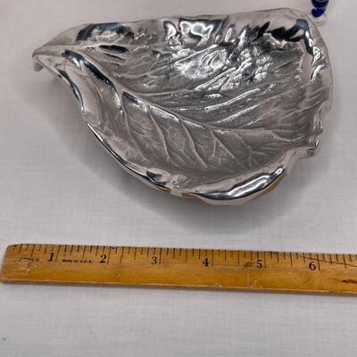 Metalware, napkin rungs, saucers, miniature animals, glass dish with lid