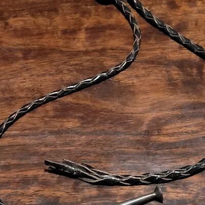 Lot 109: Vintage Navajo Sterling and Turquoise Bolo Tie and Extra Bolo Woven Leather String