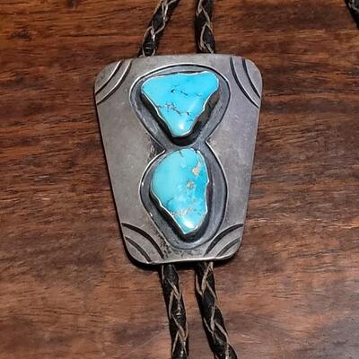 Lot 109: Vintage Navajo Sterling and Turquoise Bolo Tie and Extra Bolo Woven Leather String