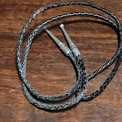 Lot 109: Vintage Navajo Sterling and Turquoise Bolo Tie and Extra Bolo Woven Leather String