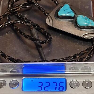Lot 109: Vintage Navajo Sterling and Turquoise Bolo Tie and Extra Bolo Woven Leather String