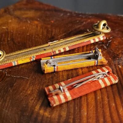 Lot 148: Vintage U.S. Military Pin Assortment (Medical Corps + Officer Stripes)