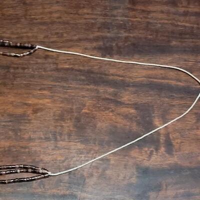 Lot 169: Old Pawn Triple Strand Santo Domingo Heishi Bead String Tied Necklace