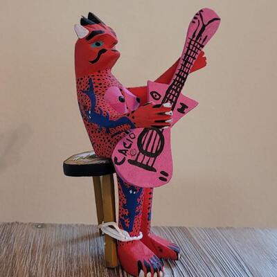 Lot 245: Mexican Handpainted Wood Folk Art Devil Playing the Guitar