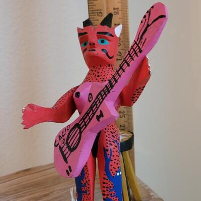 Lot 245: Mexican Handpainted Wood Folk Art Devil Playing the Guitar