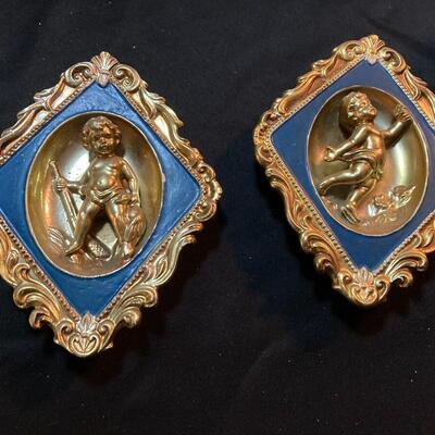 Pair of Painted Porcelain Cherub Wall Hangings