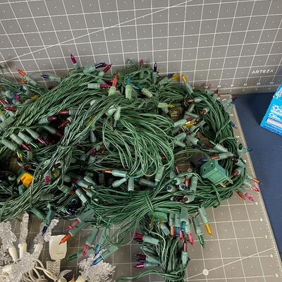 7 Green Strings of Multi Colored Lights and 1 string of Snow flake 
