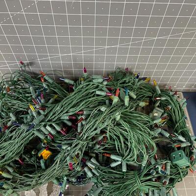 7 Green Strings of Multi Colored Lights and 1 string of Snow flake 