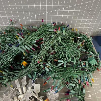 7 Green Strings of Multi Colored Lights and 1 string of Snow flake 