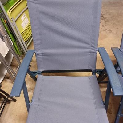 2 blue folding chairs