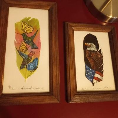 2 framed painted feathers