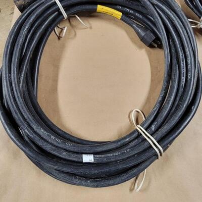 heavy duty, black extension cord, (yellow tape)