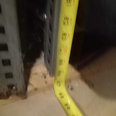 large industrial metal shelf, with solid back and right side