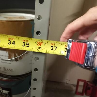 large industrial metal shelf, with solid back and right side