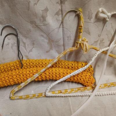 lot of vintage crochet covered clothes hangers