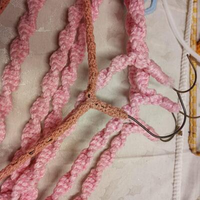 lot of vintage crochet covered clothes hangers