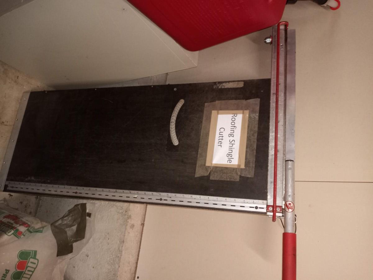 Roofing shingle cutter