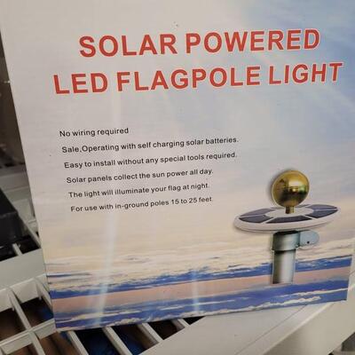 Solar powered LED flagpole light