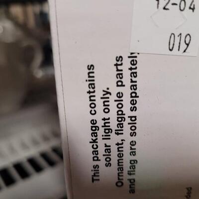 Solar powered LED flagpole light