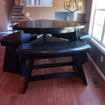 Triangle dining table and 2 curved bench seats