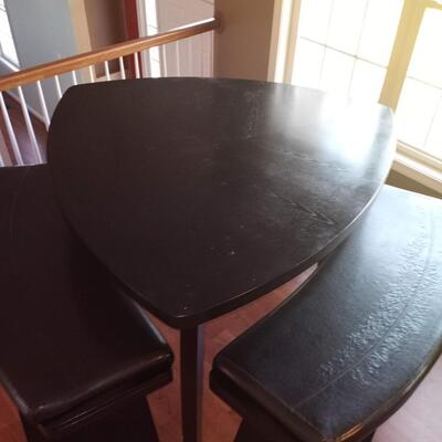 Triangle dining table and 2 curved bench seats