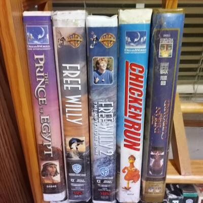 VHS tapes and wooden stand