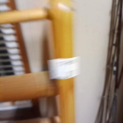 VHS tapes and wooden stand