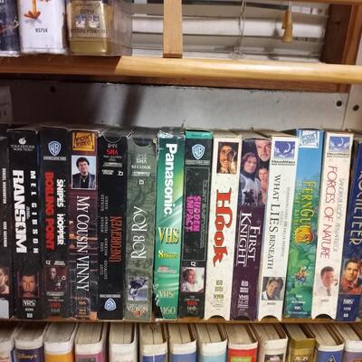 VHS tapes and wooden stand