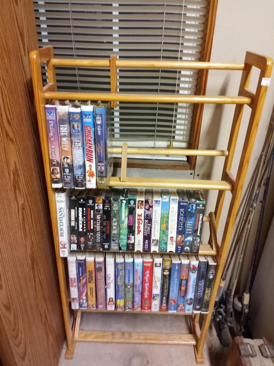VHS tapes and wooden stand