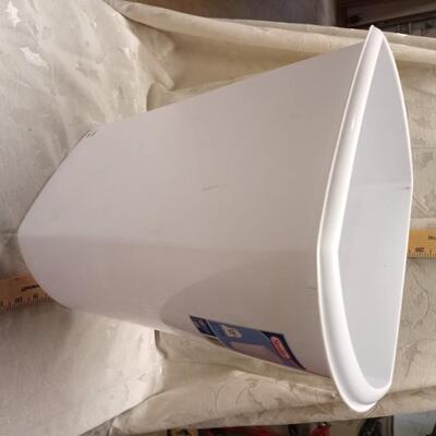 white wastebasket trash can