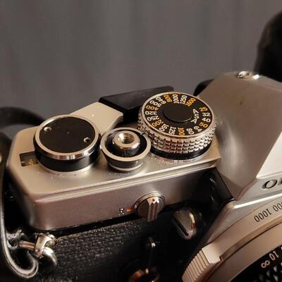 Lot 12: Vintage OLYMPUS 35mm OM-1 Camera w/ 50mm Lens & Original Travel Case