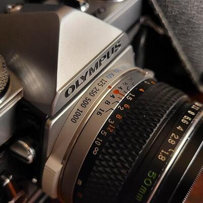 Lot 12: Vintage OLYMPUS 35mm OM-1 Camera w/ 50mm Lens & Original Travel Case