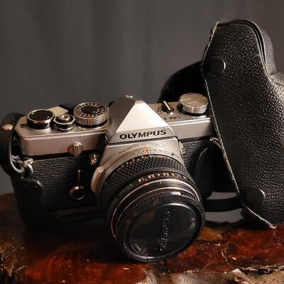 Lot 12: Vintage OLYMPUS 35mm OM-1 Camera w/ 50mm Lens & Original Travel Case
