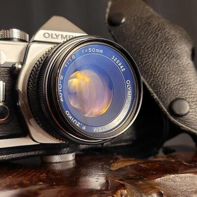 Lot 12: Vintage OLYMPUS 35mm OM-1 Camera w/ 50mm Lens & Original Travel Case
