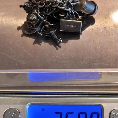Lot 38: Vintage Sterling Charm Bracelet