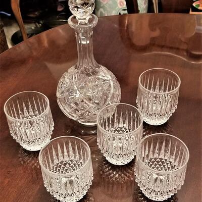 Lot #204  Crystal Decanter and 5 crystal rocks glasses