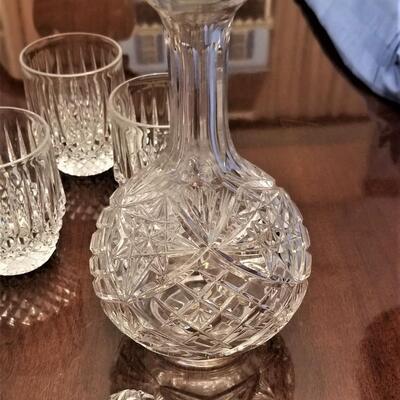 Lot #204  Crystal Decanter and 5 crystal rocks glasses