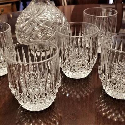 Lot #204  Crystal Decanter and 5 crystal rocks glasses