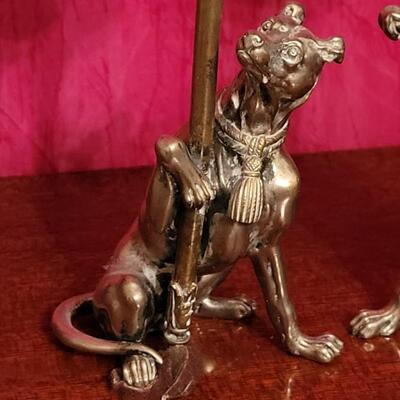Lot 60: Antique Silver and Brass Doberman Candleholders